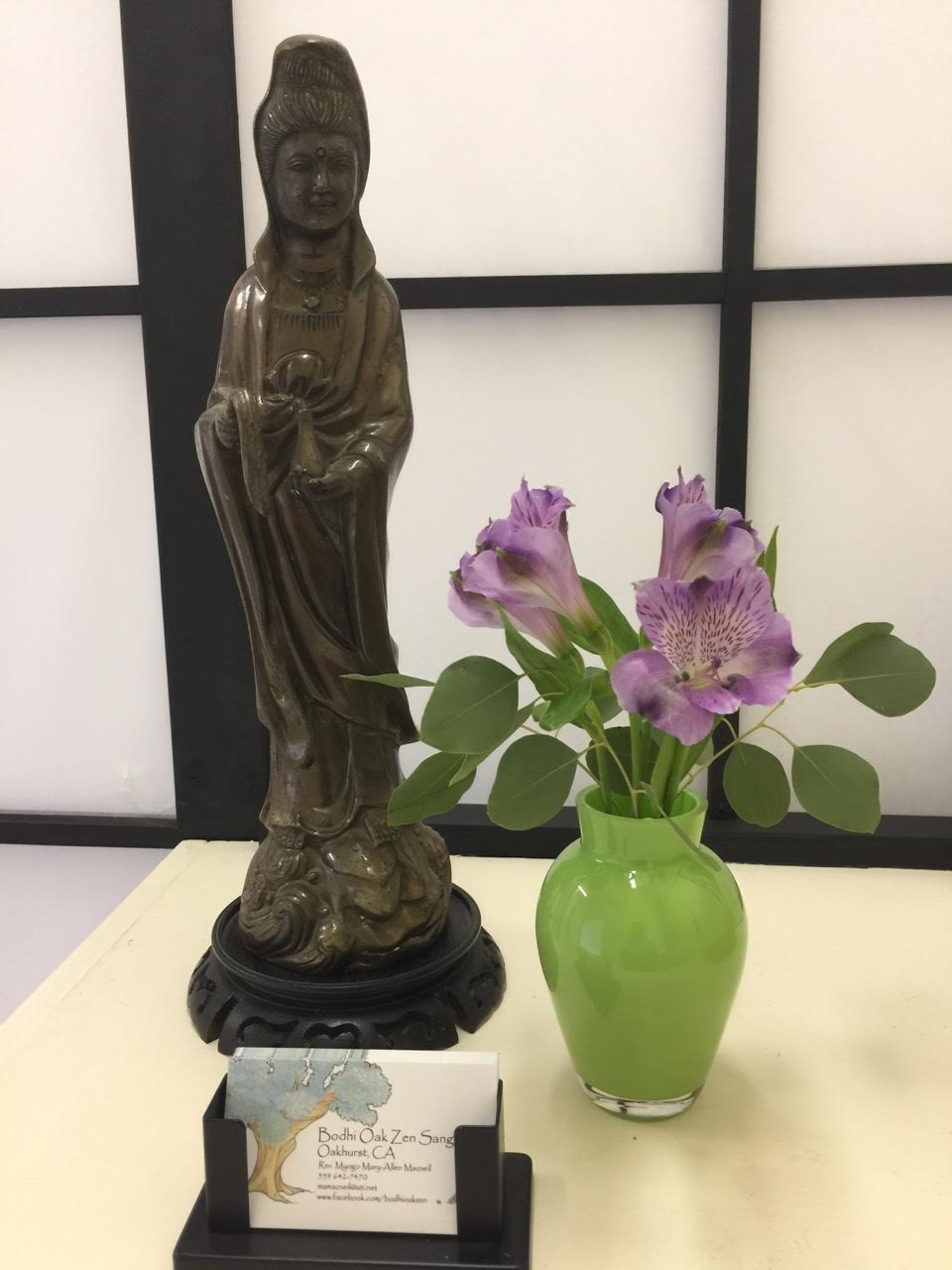 Business card and Buddhist statue
